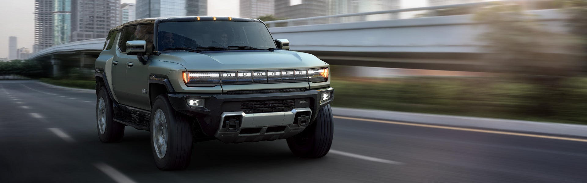 A green GMC Hummer EV