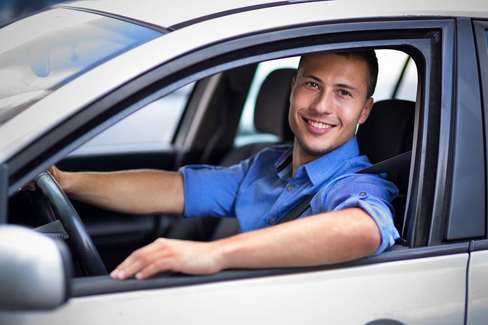 Man looking outside car window